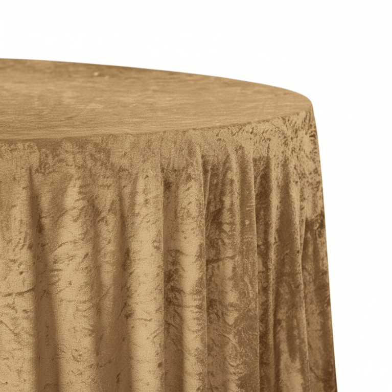 Round table with a textured mocha brown velvet tablecloth on a white background
