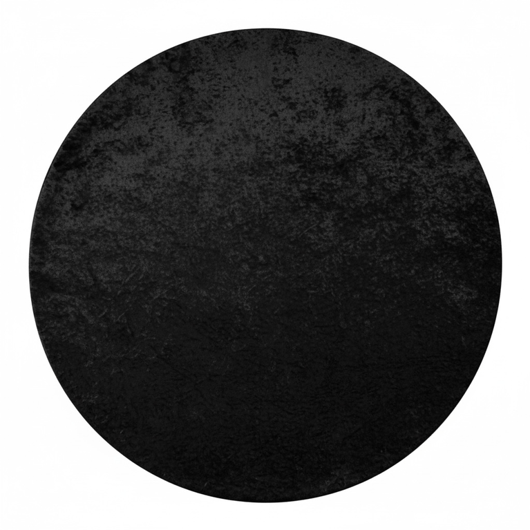 Top view of a velvet black tablecloth draping a round table on a white background