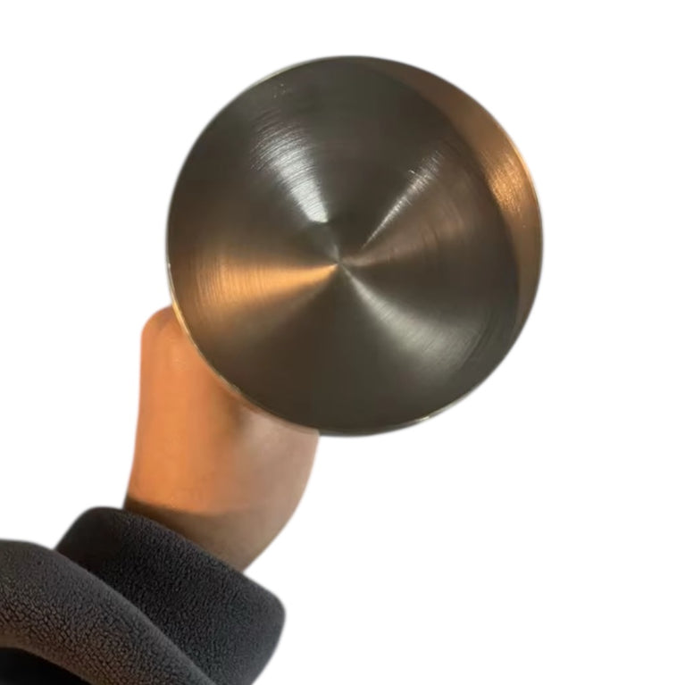 Steel goblet held by hand on a white background