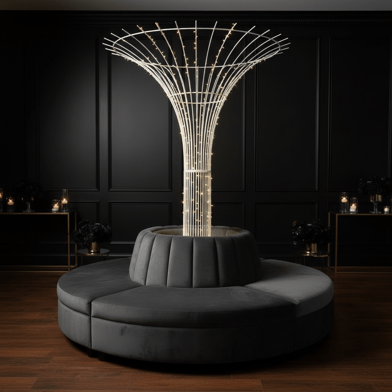 Decorative indoor wedding tree prop with lights on a dark background