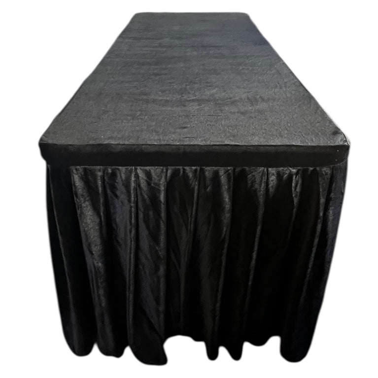 Black tablecloth on a rectangular table with a white background