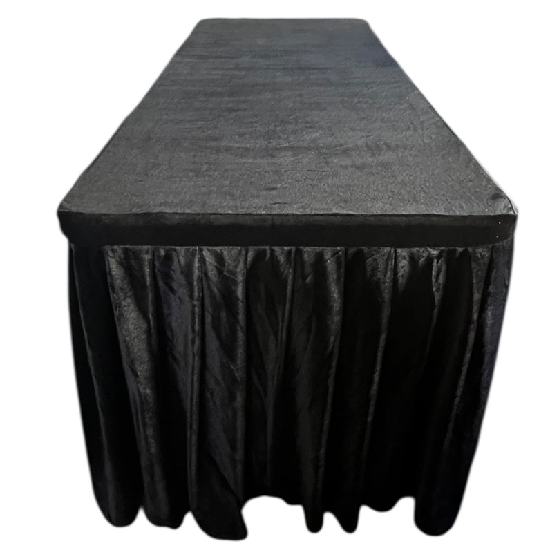 Black tablecloth on a rectangular table with a white background