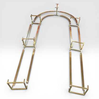 Dismantled wedding backdrop made of gold metal on a white background