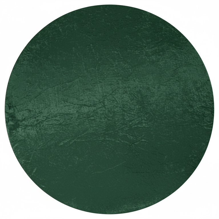 Top view of an emerald green velvet tablecloth draping a round table.