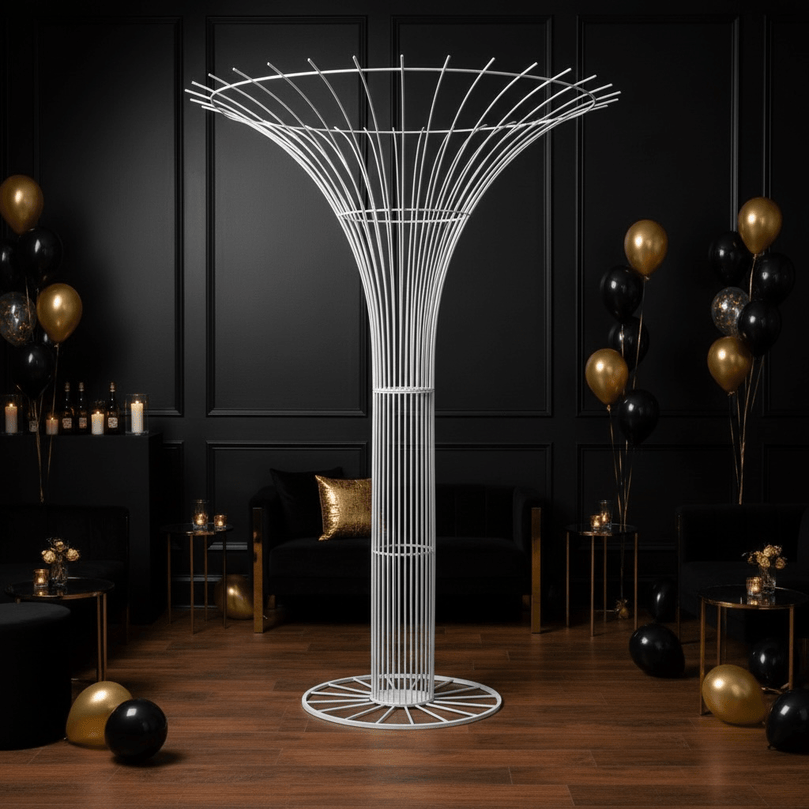 Decorative white tree-like wedding Prop structure in a room with black walls and balloons.