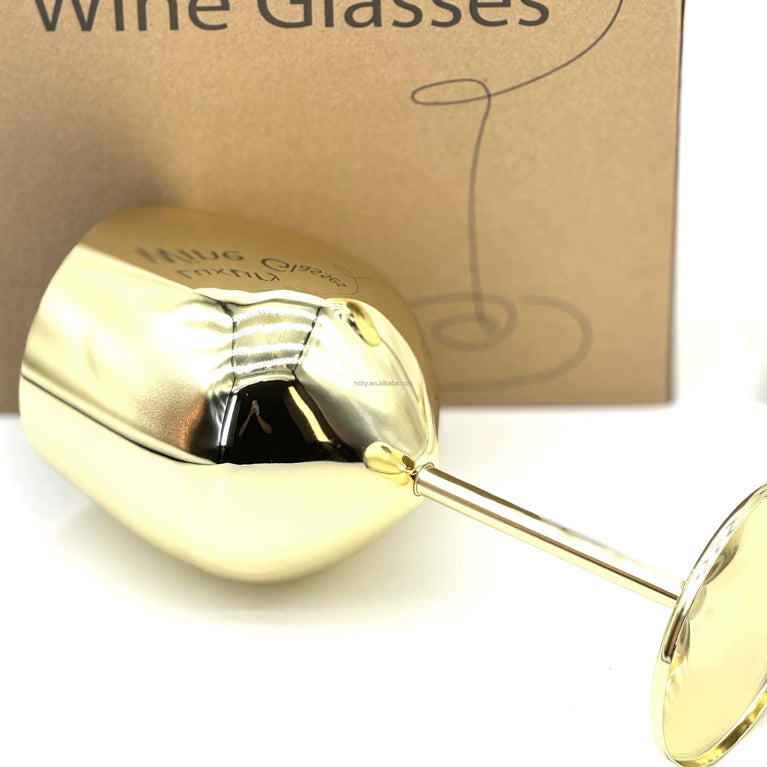 Gold wine glass with 'Wine Glasses' text on a cardboard box background