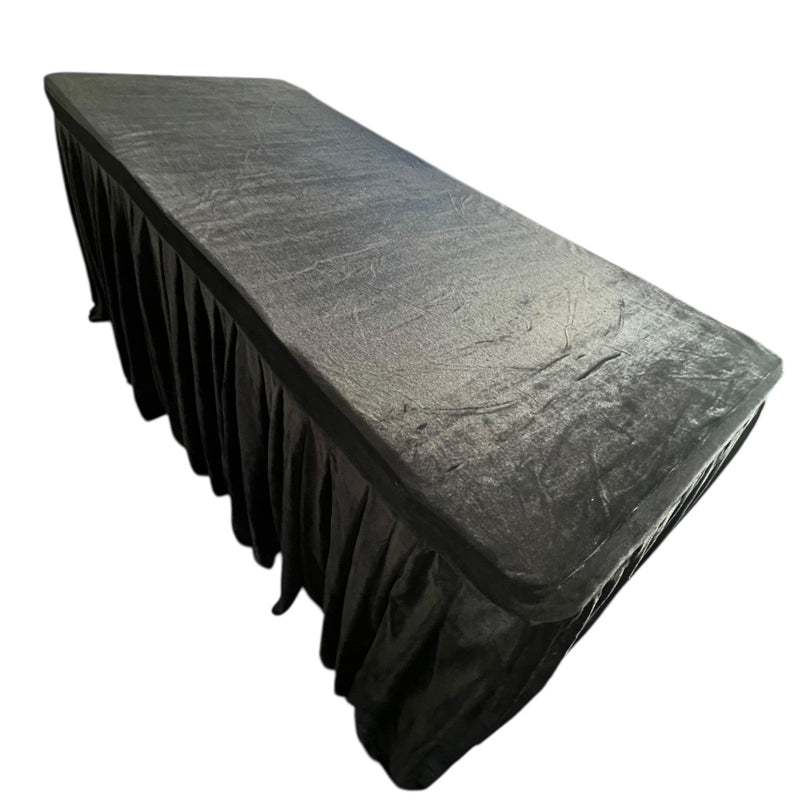 Black tablecloth on a rectangular table with a white background