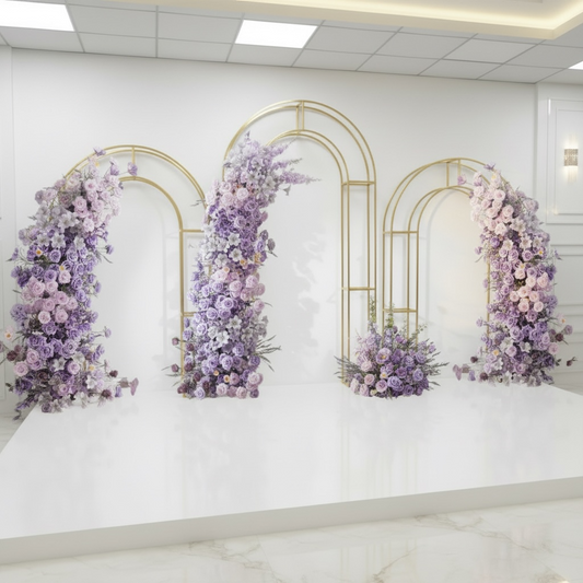 Decorative floral arches on a white wall with gold frames