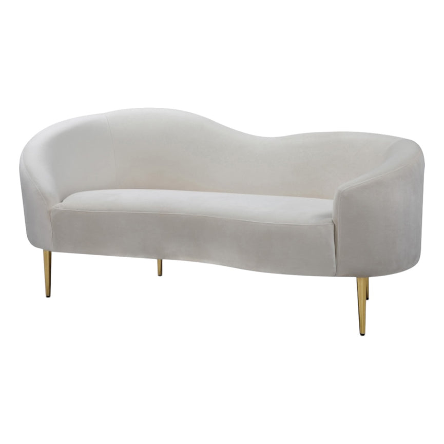 Modern curved beige sofa with gold legs on a white background