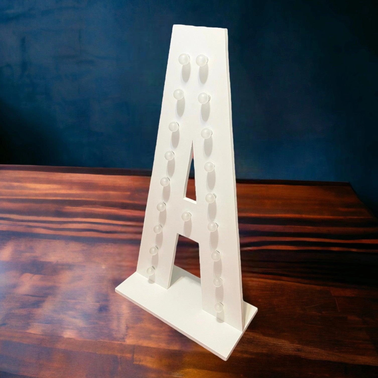 marquee light up letter A with its lights off facing sideways