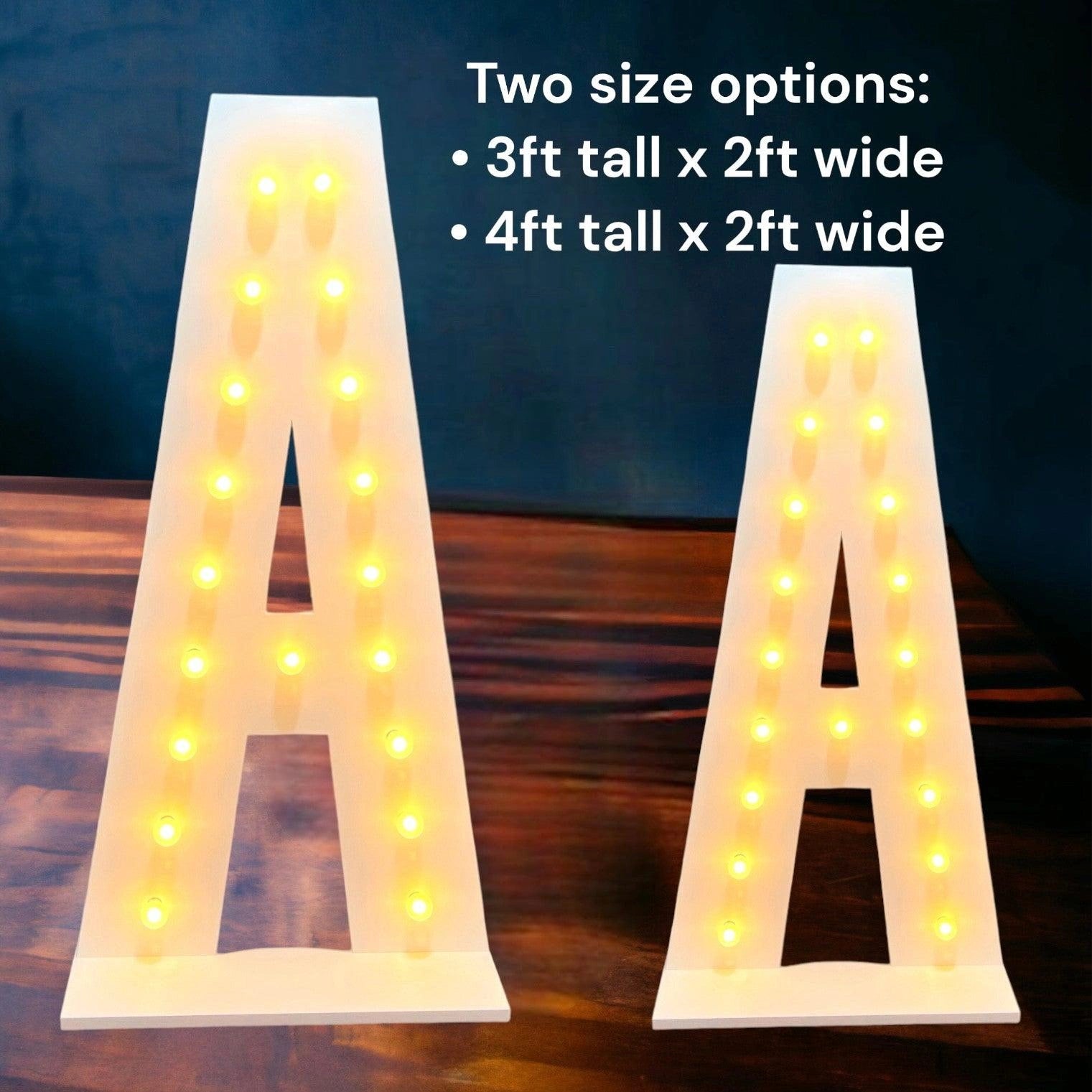 A 4 feet tall and 3 feet tall marquee light up letters A on a wooden floor