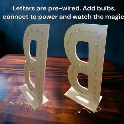 rear view of marquee light up letter b with string light wiring