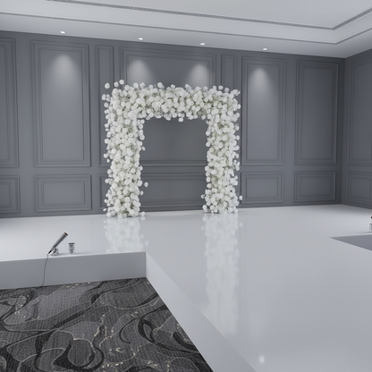 Decorative floral arch in a room with gray walls and white floor.