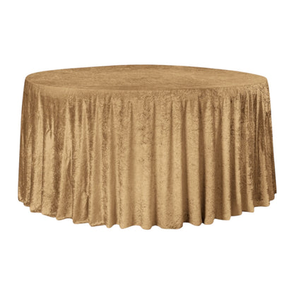 Gold mocha velvet tablecloth on a round table against a white background 