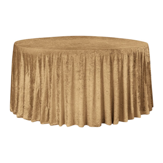 Gold mocha velvet tablecloth on a round table against a white background 