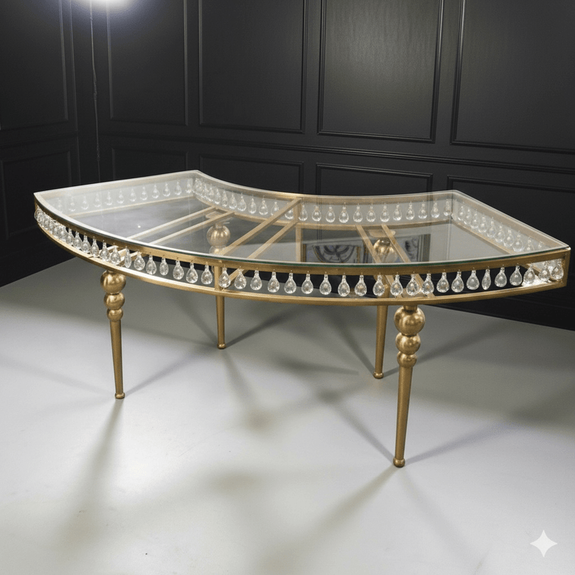 Decorative wedding table with gold frame and crystal embellishments on a white floor.