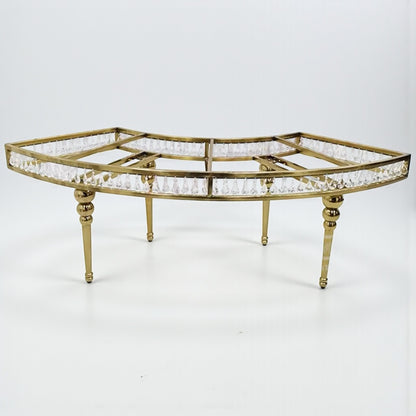 Decorative table with gold frame and crystal accents on a white background