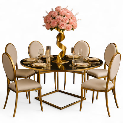 Dining table set with gold chairs and a Spiral Gold Wedding Dining Centerpiece with pink roses on a white background