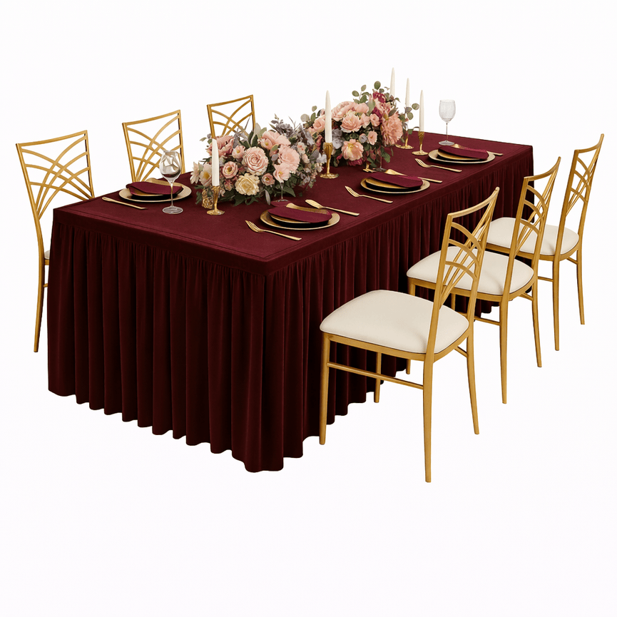 Dining table set with floral centerpiece, plates, and gold chairs on a white background