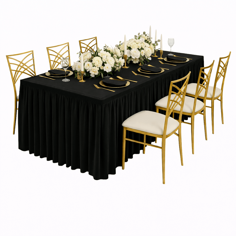 Dining table set with black tablecloth, gold chairs, and white floral centerpiece on a white background