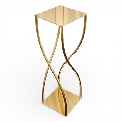 Gold metal wedding centerpiece with a modern design on a white background