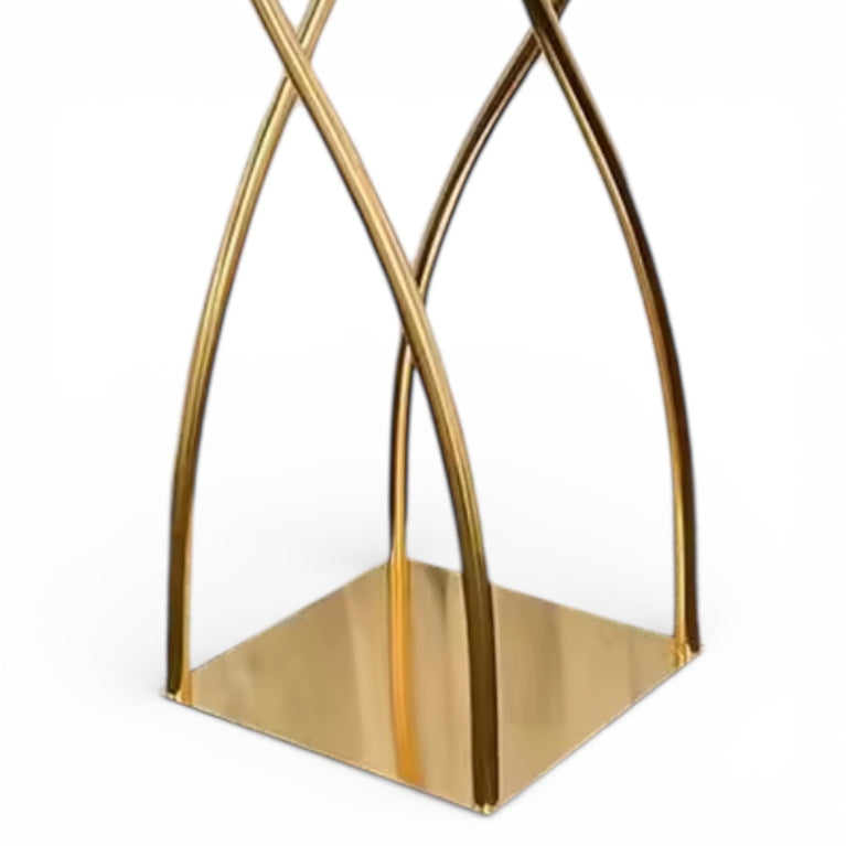 Upclose of a gold geometric decorative centerpiece base on a white background