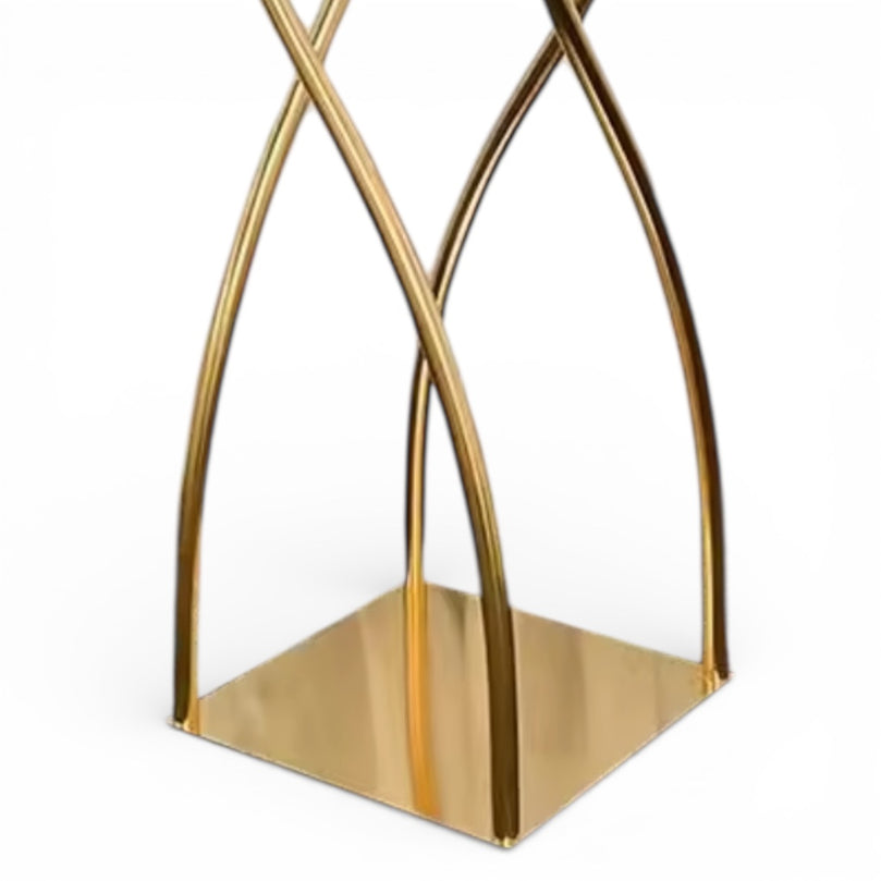 Upclose of a gold geometric decorative centerpiece base on a white background