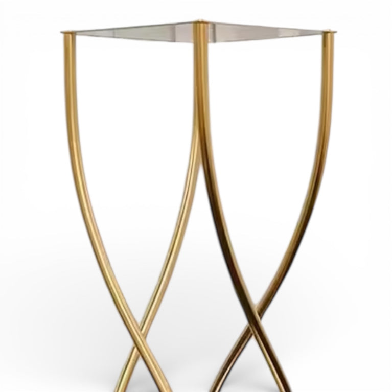 Upclose of a gold metal wedding centerpiece on a white background