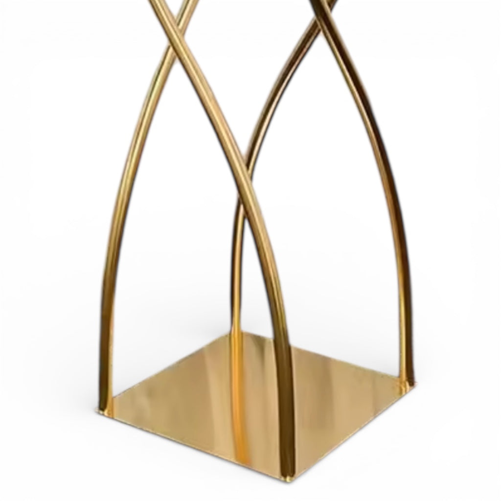Upclose of a gold geometric decorative centerpiece base on a white background
