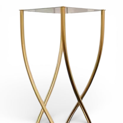 Upclose of a gold metal wedding centerpiece on a white background