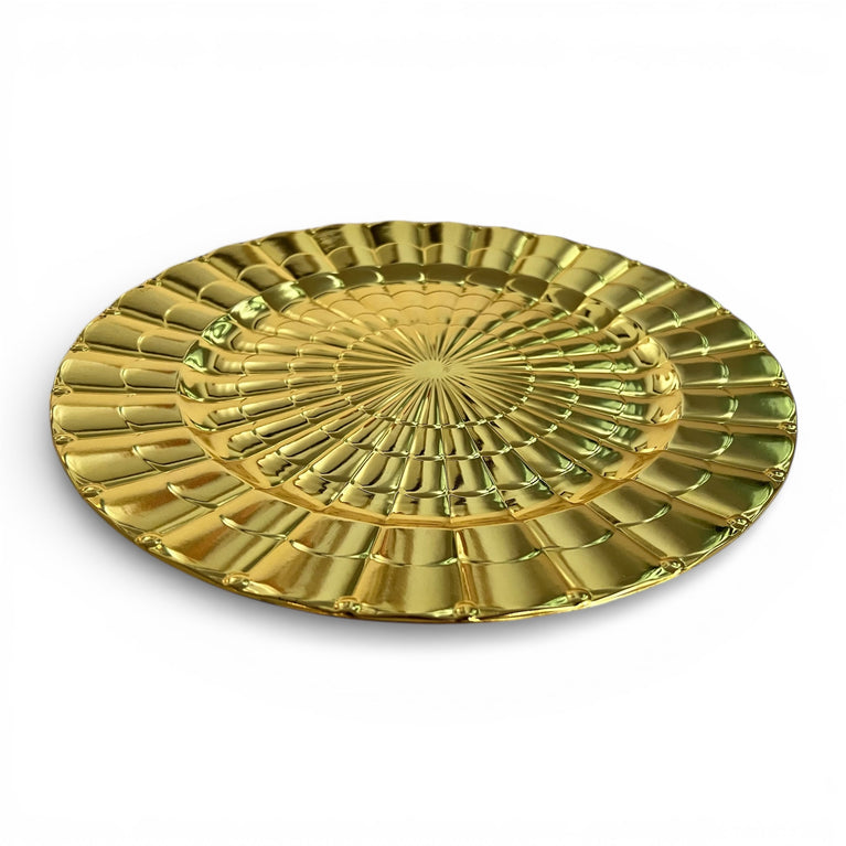 Gold decorative charger plate with a textured design on a white background