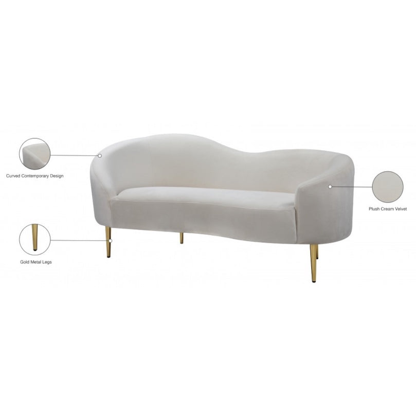 Beige sofa with gold legs on a white background