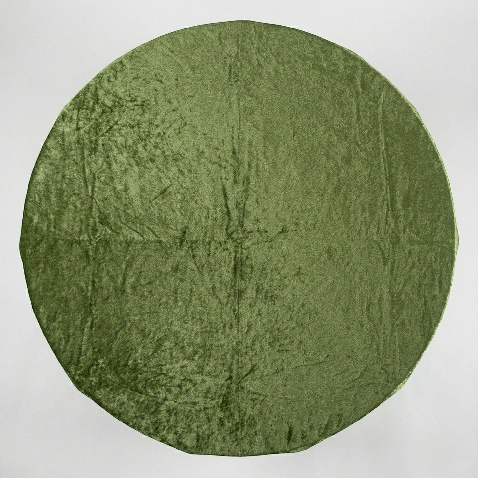 Sage green velvet tablecloth on a white background