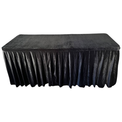 Black tablecloth on a rectangular table with a white background
