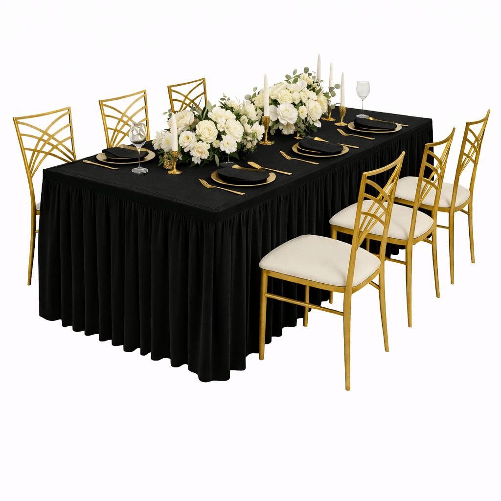 Dining table set with black tablecloth, gold chairs, and white floral centerpiece on a white background