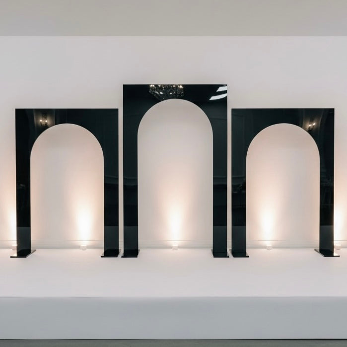 Three black wedding backdrops with arch-shaped design on a white background