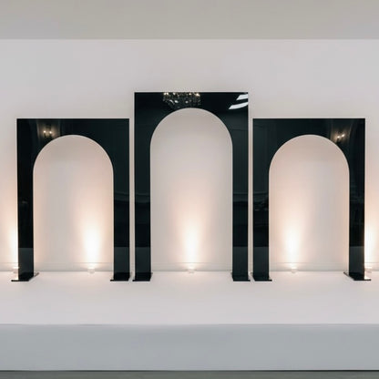 Three black wedding backdrops with arch-shaped design on a white background