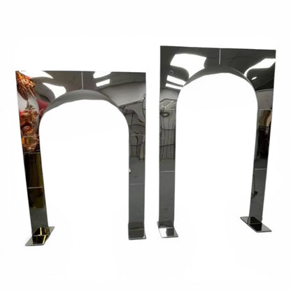 Two metallic arch-shaped wedding backdrops on a white background