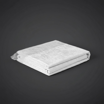 Folded white velvet tablecloth on a dark gray background