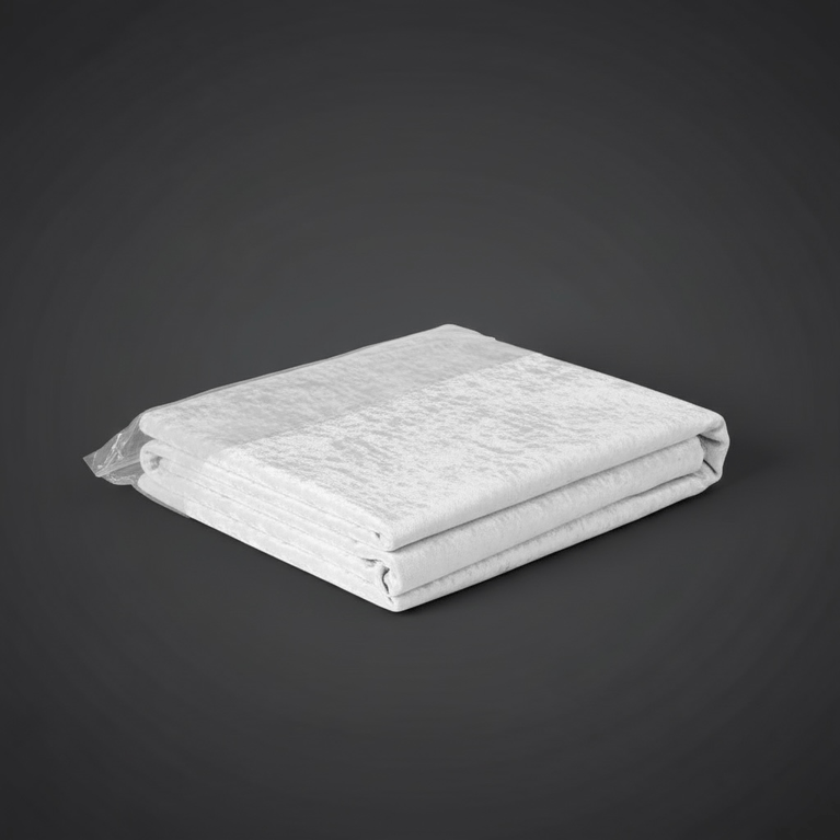 Folded white velvet tablecloth on a dark gray background